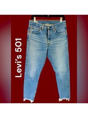 Levi’s-women’s button fly 501 jeans. 28x28 light wash/frayed hem. Excellent cond